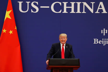 FILE PHOTO - U.S. President Donald Trump delivers his speech as he and China's President Xi Jinping meet business leaders at the Great Hall of the People in Beijing, China, November 9, 2017. REUTERS/Damir Sagolj