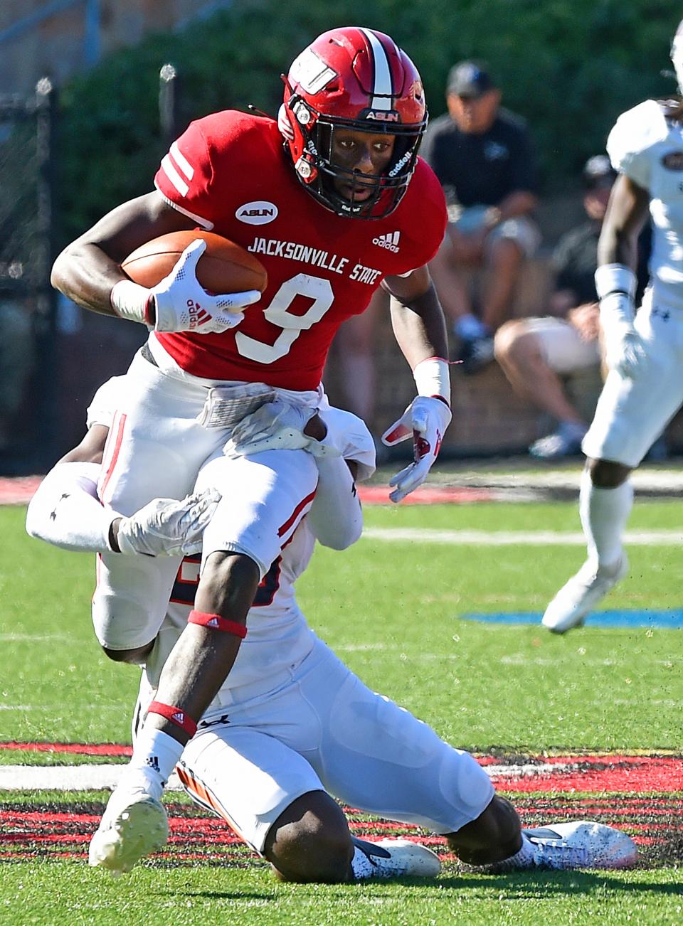 Jacksonville State's Ahmad Edwards tries to evade the tackle of UT Martin's Alexander Andre during college football action at Burgess-Snow Field Jacksonville State Stadium in Jacksonville, Alabama September 25, 2021. (Dave Hyatt: The Gadsden Times)