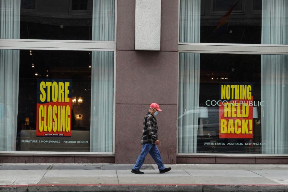 A pedestrian walks by a store that is closing on June 14, 2023 in San Francisco. Getty Images