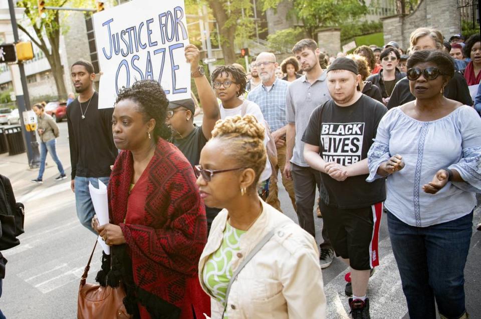 Iyun Osagie, Osaze Osagie’s mother, and a crowd of community members walk up Allen Street in downtown State College to rally for justice on May 8, 2019.