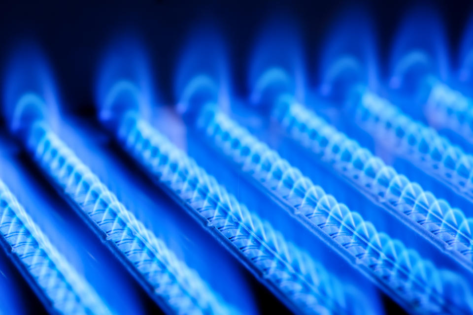 An up-close view of blue flames coming from natural gas-fueled burners.