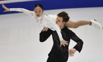 Audrey Lu and Misha Mitrofanov of USA perform in the pair's free skating program during the ISU Four Continents Figure Skating Championships in Tallinn, Estonia, Saturday, Jan. 22, 2022. (AP Photo/Sergei Stepanov)