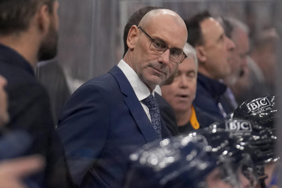 St. Louis Blues interim head coach Drew Bannister is seen on the bench during the first period of an NHL hockey game between the St. Louis Blues and the Ottawa Senators Thursday, Dec. 14, 2023, in St. Louis. (AP Photo/Jeff Roberson)