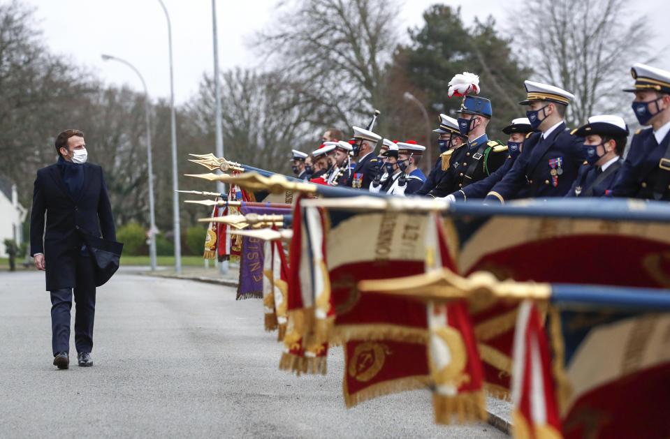 French President Emmanuel Macron review the troops prior to his New Year's speech to the French Armed Forces at Brest naval training center, western France, Tuesday, Jan. 19, 2021. (Stephane Mahe/Pool Photo via AP)