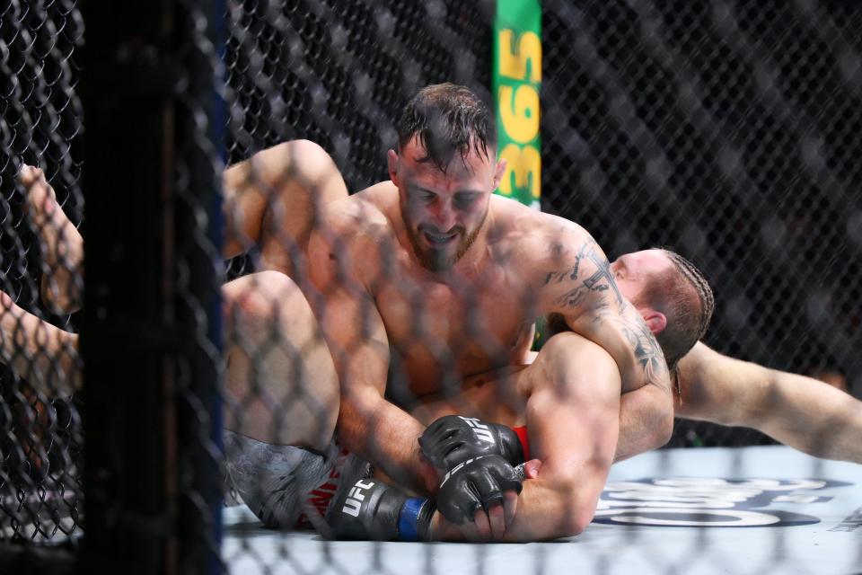 MANCHESTER, ENGLAND – JULY 27: Modestas Bukauskas of Lithuania attempts to submit Marcin Prachnio of Poland in a light heavyweight bout during the UFC 304 event at Co-op Live on July 27, 2024 in Manchester, England.  (Photo by Ben Roberts Photo/Getty Images)