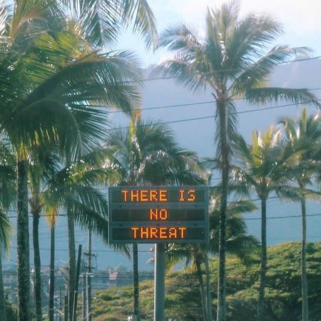 An electronic sign reads "There is no threat" in Oahu, Hawaii, U.S., after a false emergency alert that said a ballistic missile was headed for Hawaii, in this January 13, 2018 photo obtained from social media. Instagram/@sighpoutshrug/via REUTERS
