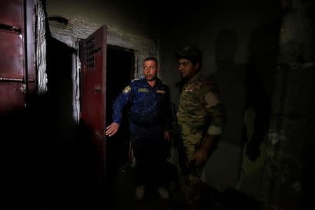Iraqi security forces inspect a building that was used as a prison by Islamic State militants in Hammam al-Ali, south of Mosul, during an operation to attack Islamic State militants in Mosul, Iraq November 7, 2016. REUTERS/Thaier Al-Sudani