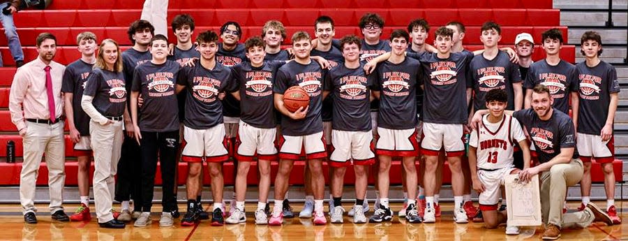 The Honesdale boys basketball team sporting their Cancer Awareness fundraising t-shirts following an impressive Lackawanna League victory.