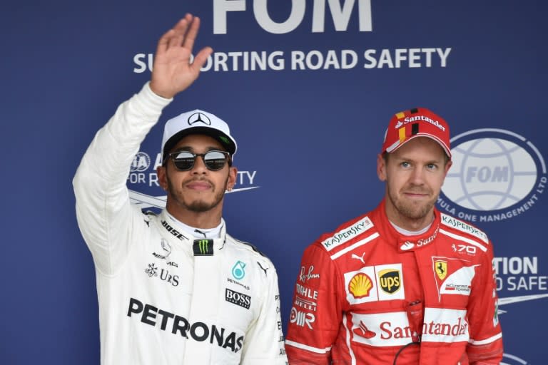 Lewis Hamilton (L) leads nearest rival Sebastian Vettel by 59 points with four races remaining