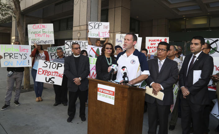 Brent Wilkes, national executive director of the League of United Latin American Citizens, speaks as demonstrators protest against Herbalife, a nutrition and supplements company, outside the Ronald Reagan State Office building in Los Angeles, California October 18, 2013.  (Photo: Fred Prouser/Reuters)