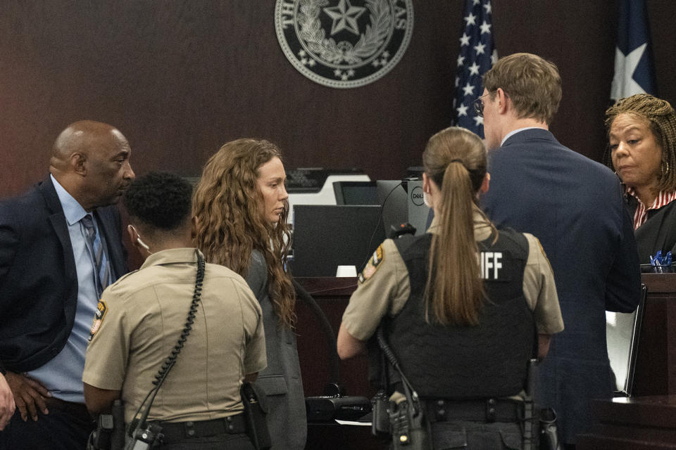 Kaitlin Armstrong approached the bench of Judge Brenda Kennedy during the sentencing portion of her murder trial at the Blackwell-Thurman Criminal Justice Center on Friday, Nov. 17, 2023, in Austin, Texas. Armstrong was found guilty of killing Anna "Mo" Wilson in May 2022 and sentenced to 90 years in prison. (Mikala Compton/Austin American-Statesman via AP, Pool)