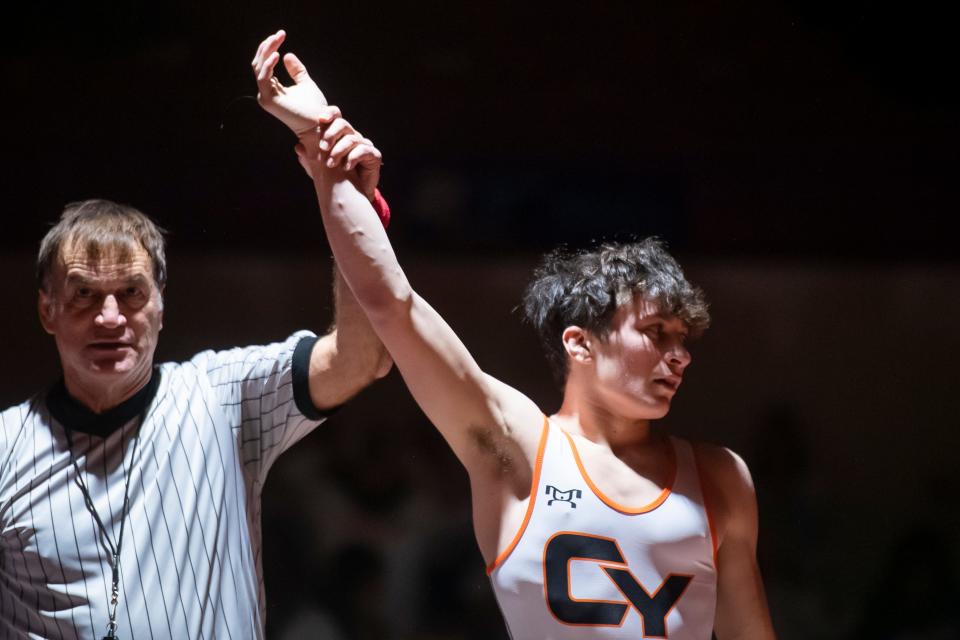 Central York's Elias Long has his hand raised after winning his 133-pound bout during a YAIAA Division I dual meet against Spring Grove at Central York High School on Wednesday, Dec. 14, 2022, in Springettsbury Township. The Rockets won, 39-33.