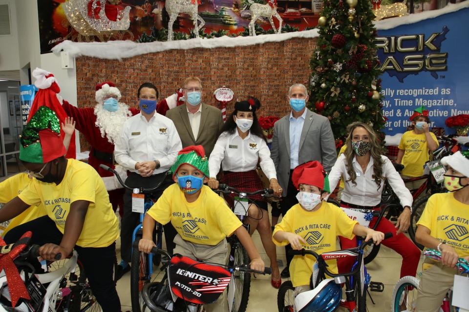 The Case family hand out bikes at the Boys Girls Clubs of Broward County in Florida. Since 1982, the
"Rick Case Bikes for Kids" program has provided thousands of needy children with a bicycle during the holidays. Rita Case, CEO of Rick Case Automotive Group, said  bike donations are coming in record numbers this year.