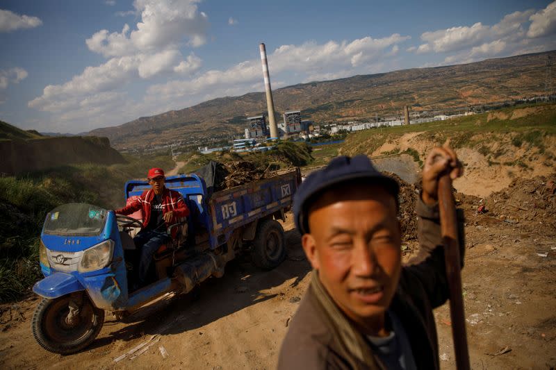 The Wider Image: Energy security and economic fears drive China's return to coal