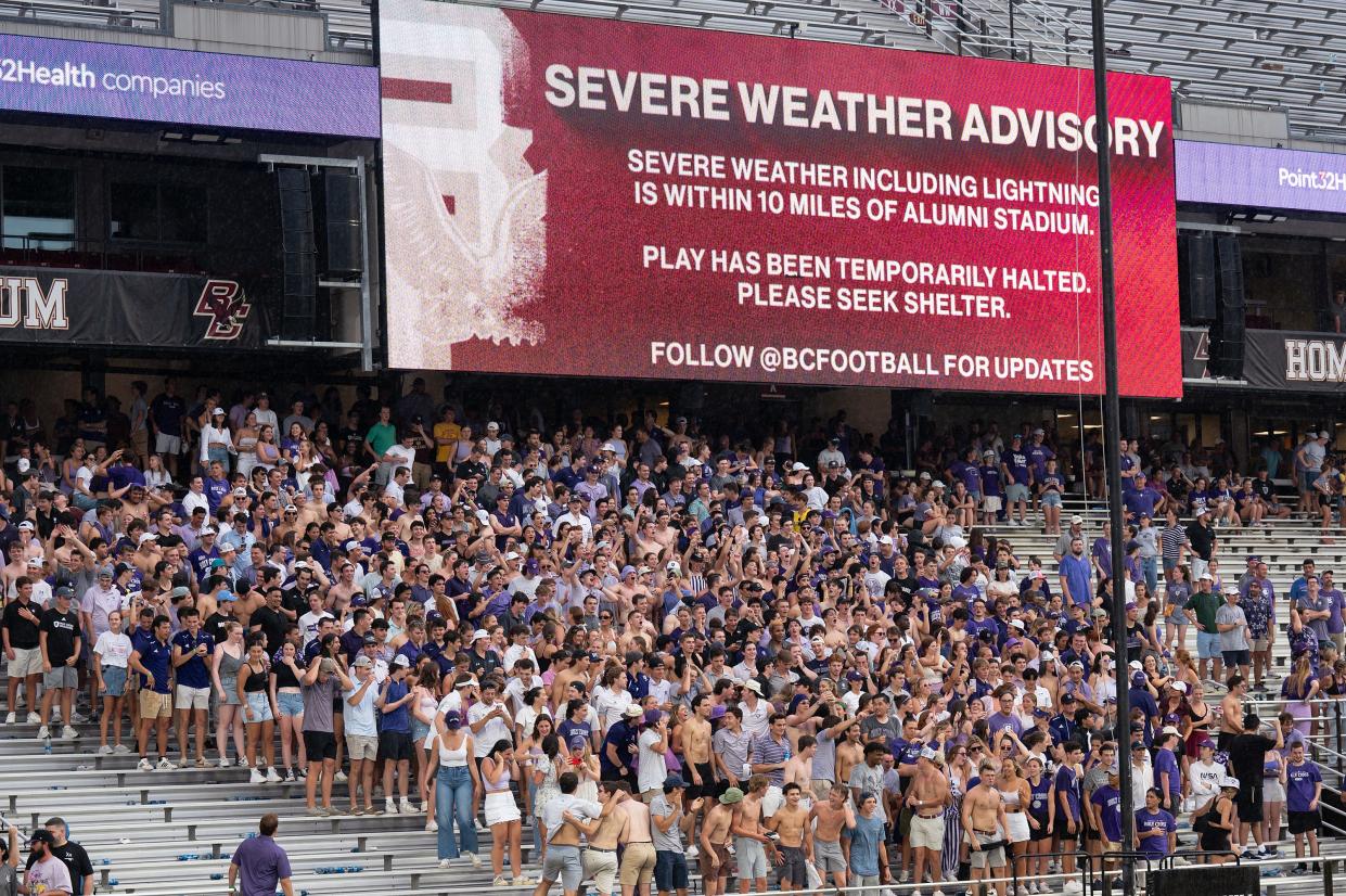 Holy Cross fans waited out the lightning and stayed in the stands versus Boston College on Saturday September 9, 2023 at Alumni Stadium in Newton.