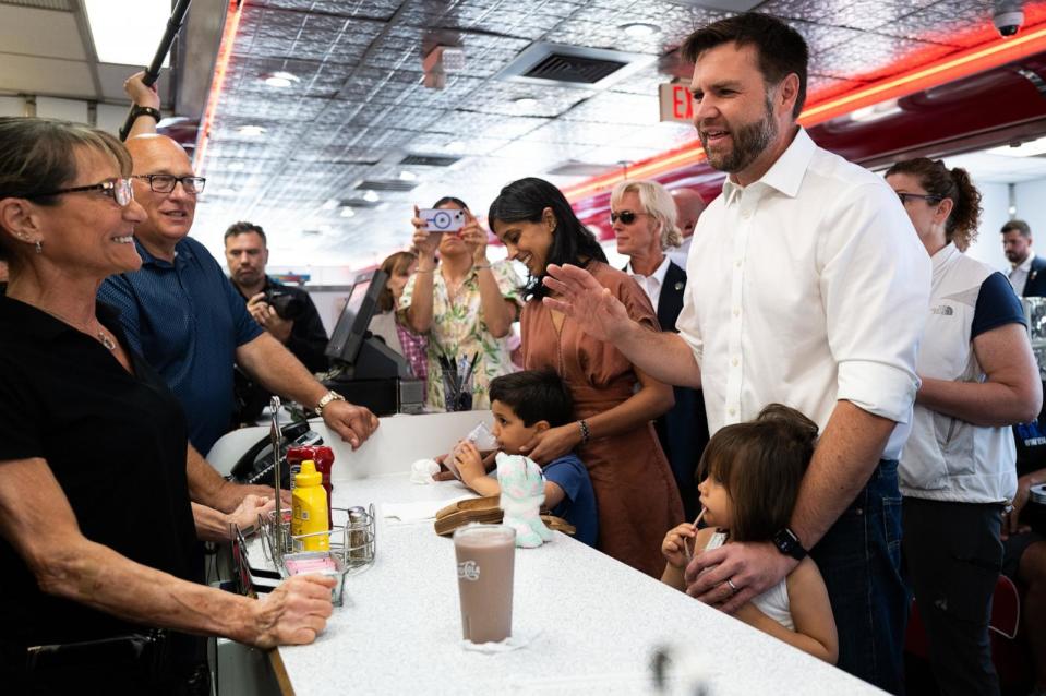 PHOTO: Republican vice presidential nominee Sen. J.D. Vance and his family greet supporters at the Park Diner in St. Cloud, MN, July 28, 2024. (Stephen Maturen/Getty Images)