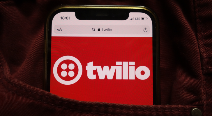 Twilio Inc (TWLO) logo displayed on mobile phone hidden in jeans pocket