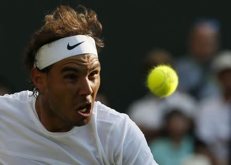 Rafael Nadal of Spain hits a shot during his match against Dustin Brown of Germany at the Wimbledon Tennis Championships in London, July 2, 2015. REUTERS/Stefan Wermuth