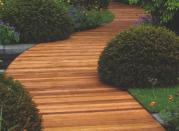 <p> A wide pathway makes for convivial strolling through your outdoor space. Using wood for your garden path will again, help keep a natural feel in your garden, but that&apos;s not to say it can&apos;t look contemporary too. Choose a light colored wood and surround it with perfectly formed topiary and cut grass for a neat finish that will conceal uneven and unsightly ground too. Decking and garden path ideas in one, we love it.&#xA0; </p>