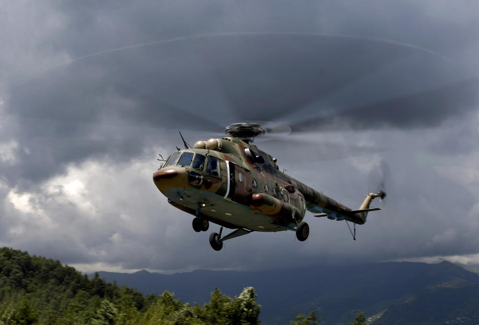 An army helicopter prepares to land at a hilltop post in Chiri Kot sector near the Line of Control, that divides Kashmir between Pakistan and India, Wednesday, July 22, 2020. Villagers living along a highly militarized frontier in the disputed region of Kashmir have accused India of "intentionally targeting" civilians, but they are vowing that they would never leave their areas. Villagers say the fear of death is no longer present in their hearts after spending so many years in a state of shock and uncertainty. (AP Photo/Anjum Naveed)