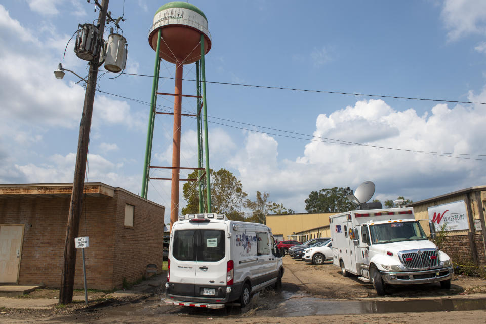 FILE - Emergency personnel arrive to evacuate people at a mass shelter, Sept. 2, 2021 in Independence, La. A nursing home owner already facing criminal and civil complaints over the evacuation of residents to a squalid warehouse to ride out Hurricane Ida in 2021 faces a new lawsuit by federal authorities Thursday, Jan. 12, 2023, saying he misspent $4 million in violation of federal regulations. (Chris Granger/The New Orleans Advocate via AP)