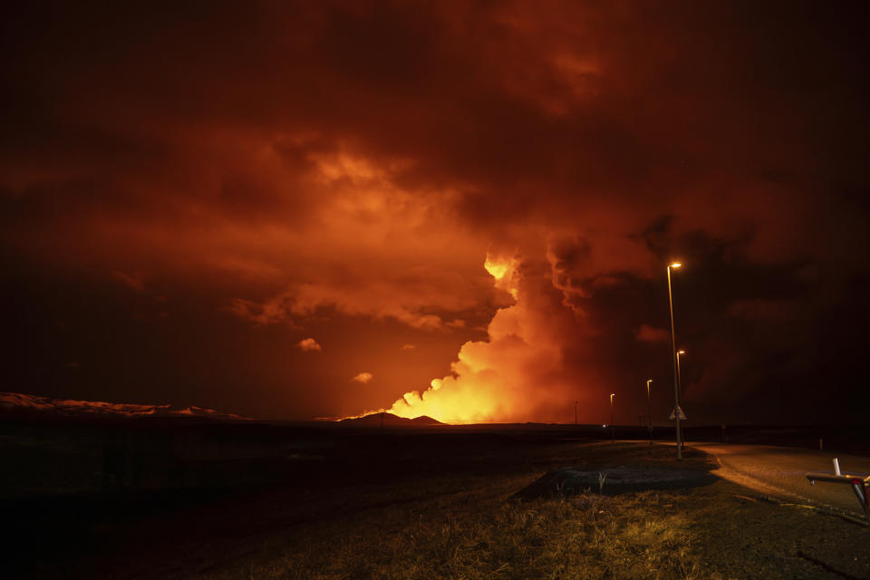 Plumes of smoke rise from volcanic activity between Hagafell and Stóri-Skógfell, Iceland, on Saturday, March 16, 2024. (AP Photo/Marco di Marco)