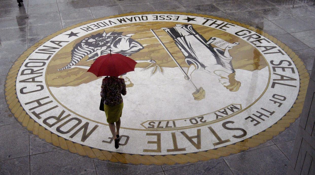 A woman leaves the N.C. Legislative Building in Raleigh, N.C. in this 2005 file photo. State lawmakers in 2023 are expected to consider passing new laws regarding abortion, gambling, medical marijuana, attacks on electrical infrastructure, and Medicaid.