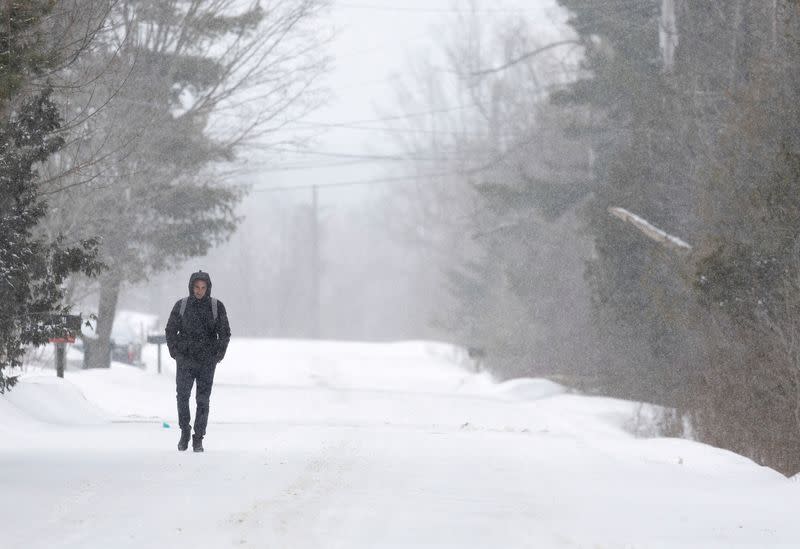 FILE PHOTO: Asylum seekers cross into Canada from Roxham Road in Champlain New York