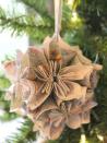 <p>Recycle your old paper maps by turning them into ornaments! Simply follow this blogger's surprisingly easy folding technique, then loop with a ribbon to finish.</p><p><strong>Get the tutorial at <a href="http://chiccalifornia.com/2014/11/20/trim-tree-blog-hop/" rel="nofollow noopener" target="_blank" data-ylk="slk:Chic California" class="link ">Chic California</a>.</strong></p>