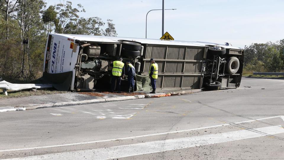 Investigators at the bus crash scene