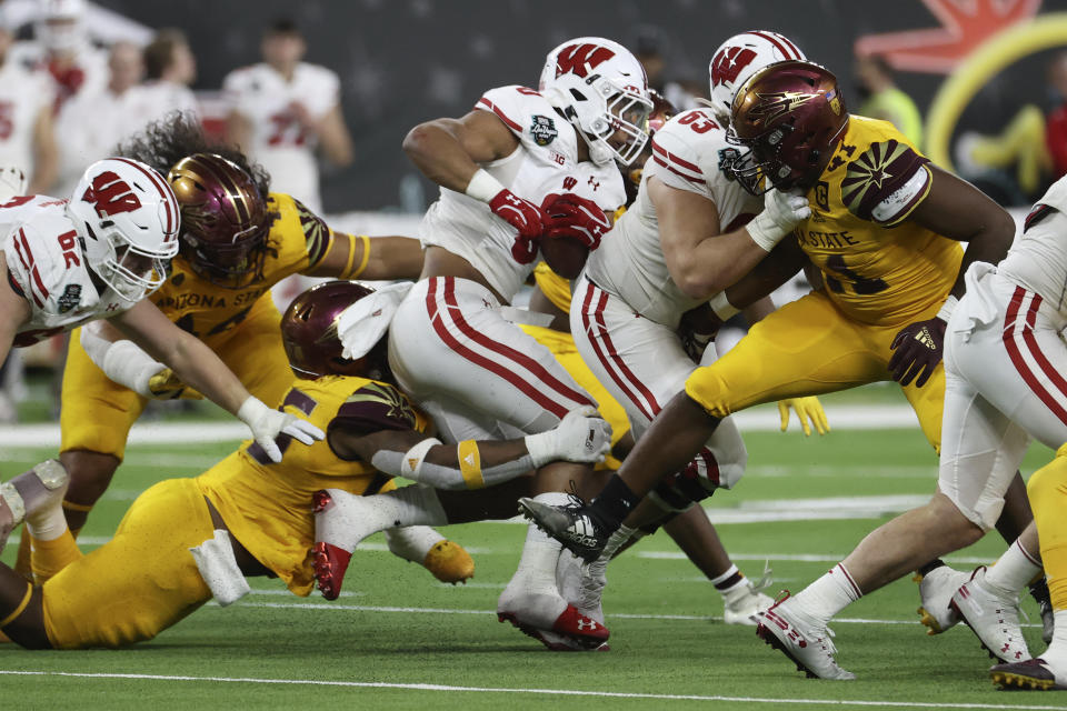 Wisconsin running back Braelon Allen (0) runs against Wisconsin during the first half of the Las Vegas Bowl NCAA college football game Thursday, Dec. 30, 2021, in Las Vegas. (AP Photo/L.E. Baskow)