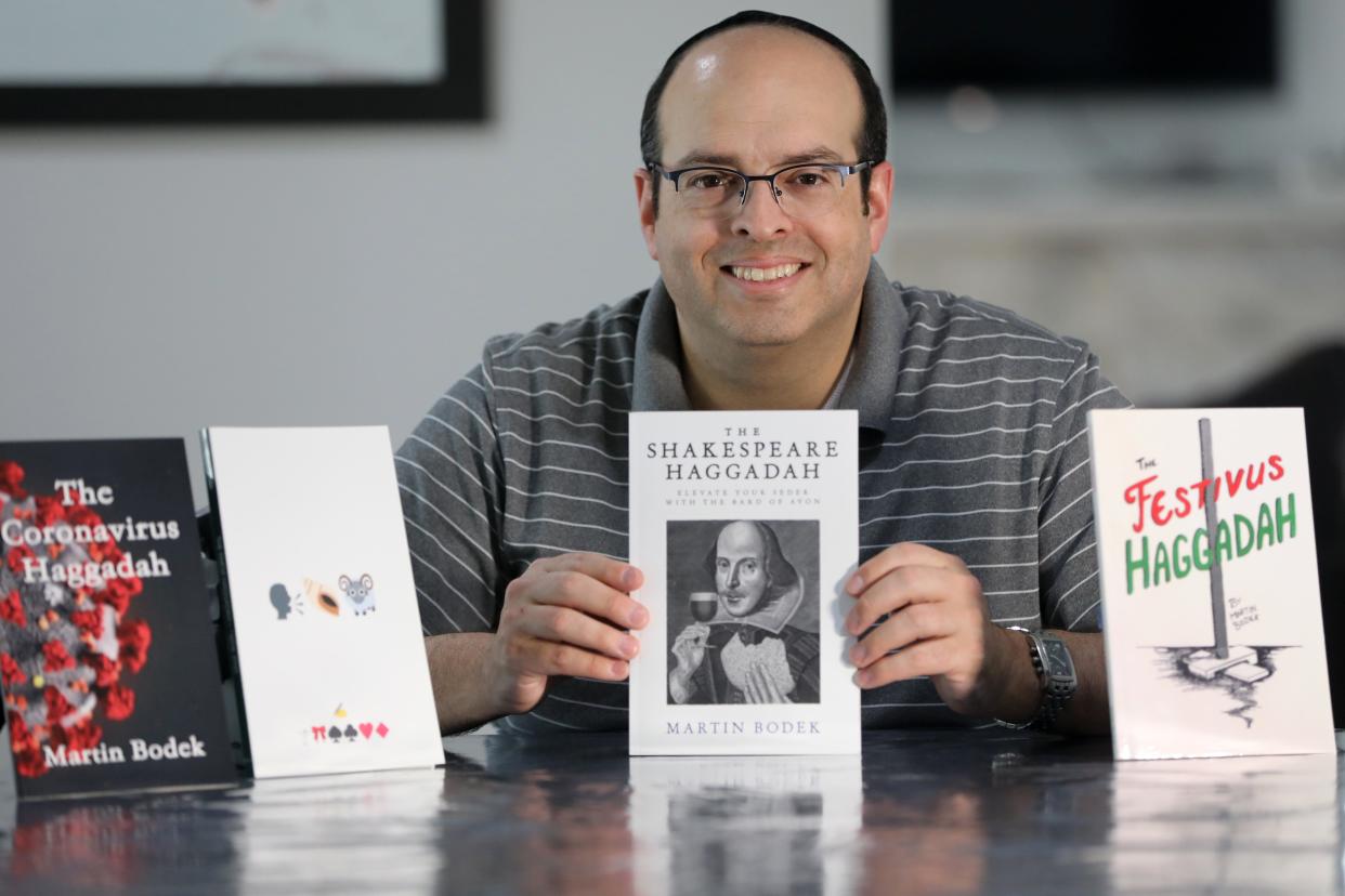 Martin Bodek is the author of the new Shakespeare Haggadah. He poses here, in his Teaneck home with his other Haggadahs. Tuesday, March 22, 2022