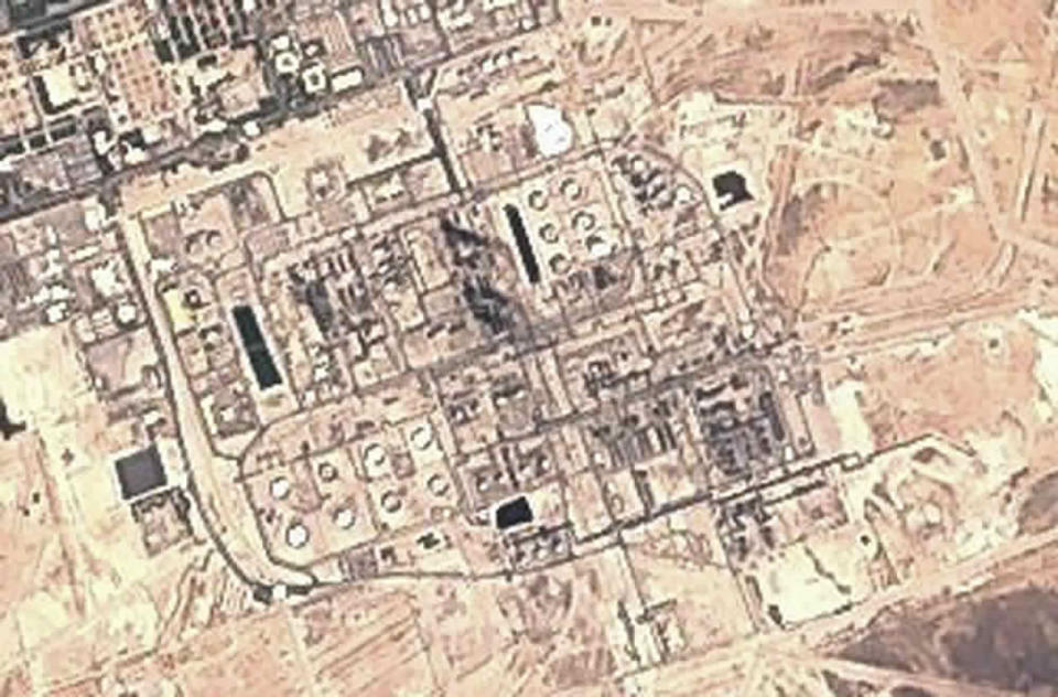 This Sunday, Sept. 15, 2019 false-color image from the European Commission's Sentinel-2 satellite shows Saudi Aramco's Abqaiq oil processing facility in Buqyaq, Saudi Arabia. Yemen's Houthi rebels claimed to have launched drone attacks on the world's largest oil processing facility in Saudi Arabia and a major oil field Saturday, sparking huge fires and halting about half of the supplies from the world's largest exporter of oil. Black char marks at the center of the facility suggest the attack struck at the heart of the processing facility (European Commission via AP)