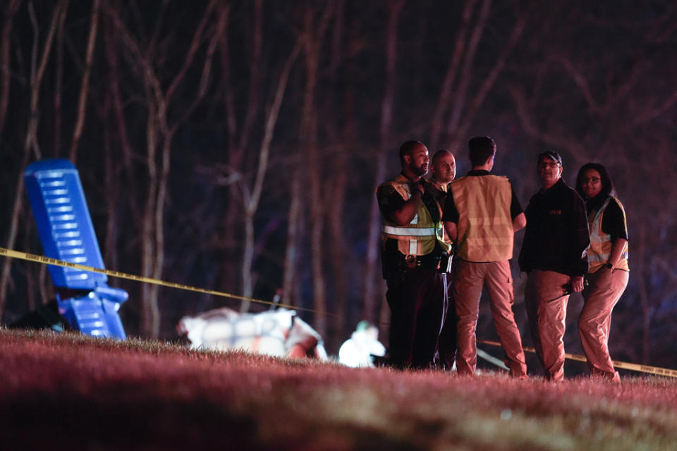Emergency officials work the scene of a fatal small plane crash alongside Interstate 40 near mile marker 202, Monday, March 4, 2024, in Nashville, Tenn. (AP Photo/George Walker IV)