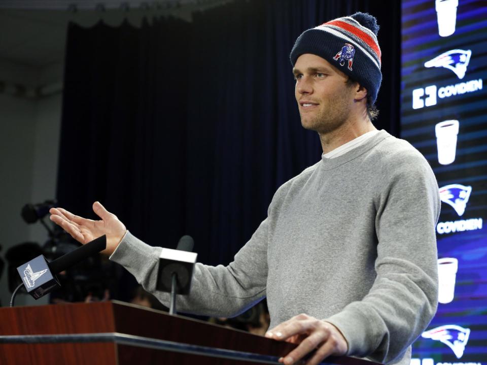 FILE - In this Jan. 22, 2015, file photo, New England Patriots quarterback Tom Brady speaks at a news conference in Foxborough, Mass. Brady did not attend a 2015 celebration at the White House because of what the he insisted was a "family commitment" but others speculated was because of some unflattering comments a spokesman for President Barack Obama made about the Deflategate scandal. (AP Photo/Elise Amendola, File)