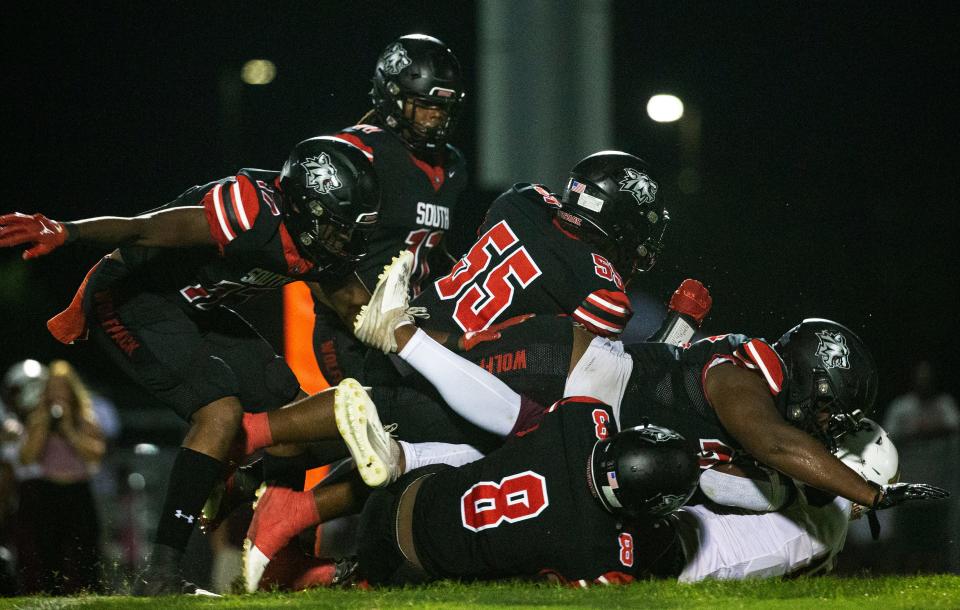 The defense for the South Fort Myers High School football team stuffs a runner from Riverdale during a game on Friday, Sept. 1, 2023. South Fort Myers won. (Andrew West/The News-Press a part of the USA Today Network)