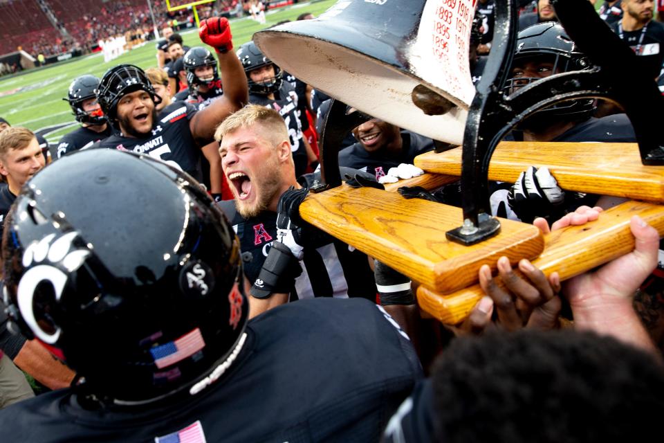 Cincinnati Bearcats linebacker Joel Dublanko (41) screams while holding the Victory Bell after the NCAA football game on Saturday, Sept. 4, 2021, at Nippert Stadium in Cincinnati. Cincinnati Bearcats defeated Miami Redhawks 49-14. 