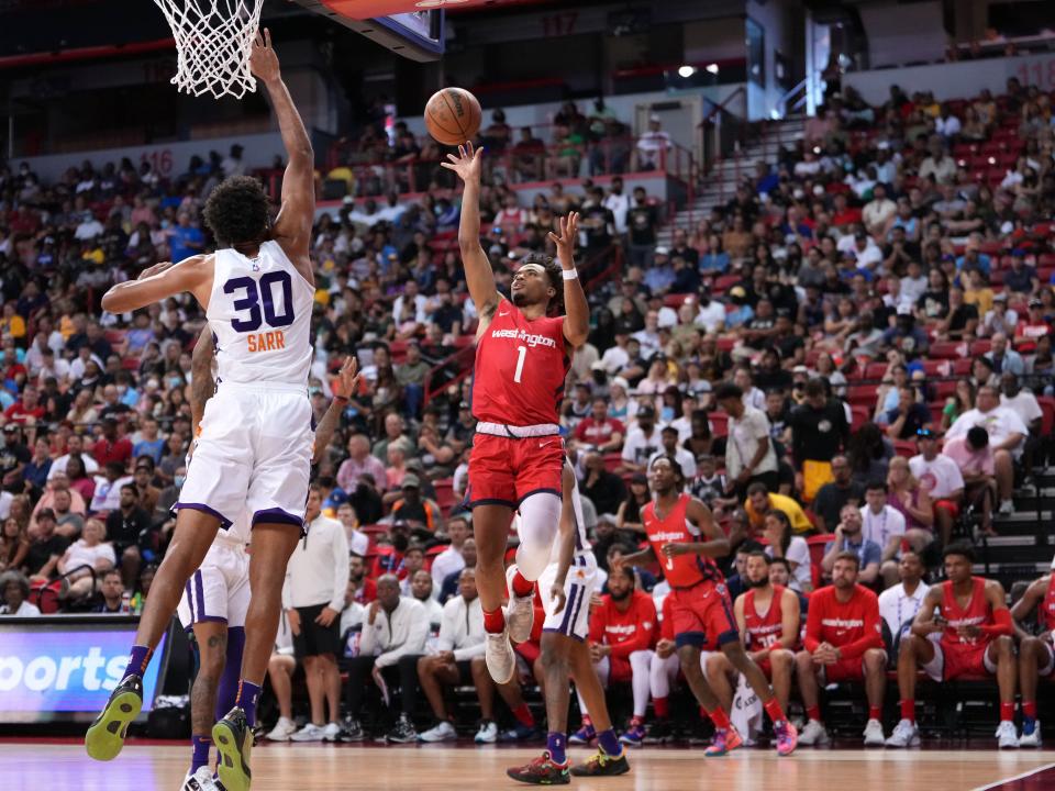 Washington Wizards guard Devon Dotson (1) shoots against Phoenix Suns center Olivier Sarr (30) during an NBA summer league game at Thomas & Mack Center in the Las Vegas area earlier this month. Dotson played in college for Kansas.