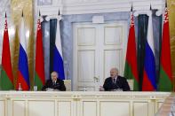 Russian President Vladimir Putin, left, and Belarus President Alexander Lukashenko attend a meeting of the Union State Supreme Council in St. Petersburg, Russia, Monday, Jan. 29, 2024. (Dmitry Astakhov, Sputnik, Government Pool Photo via AP)