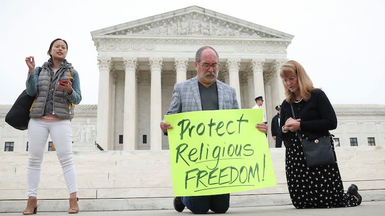 People praying at Supreme Court