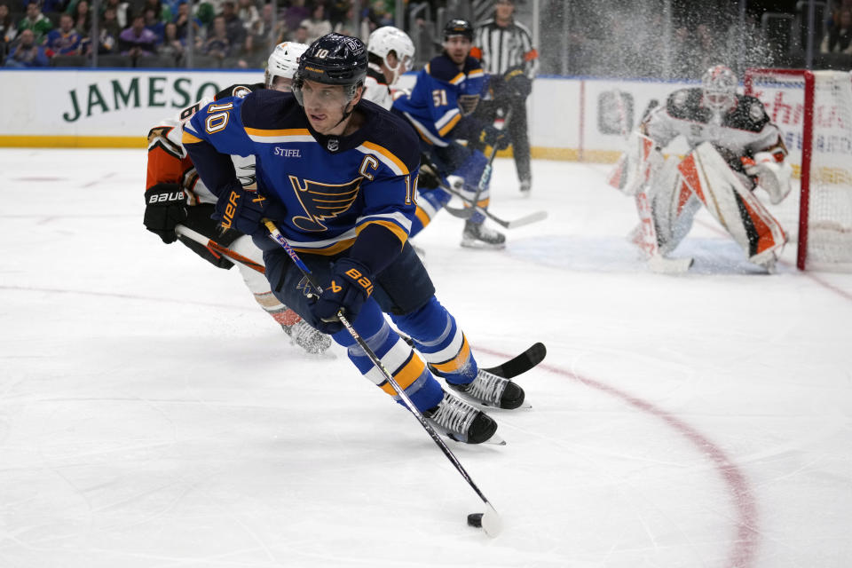 St. Louis Blues' Brayden Schenn (10) controls the puck during the second period of an NHL hockey game against the Anaheim Ducks Sunday, March 17, 2024, in St. Louis. (AP Photo/Jeff Roberson)
