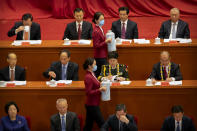 Attendants wearing face masks refill glasses during an event to honor some of those involved in China's fight against COVID-19 at the Great Hall of the People in Beijing, Tuesday, Sept. 8, 2020. Chinese leader Xi Jinping is praising China's role in battling the global coronavirus pandemic and expressing support for the U.N.'s World Health Organization, in a repudiation of U.S. criticism and a bid to rally domestic support for Communist Party leadership. (AP Photo/Mark Schiefelbein)