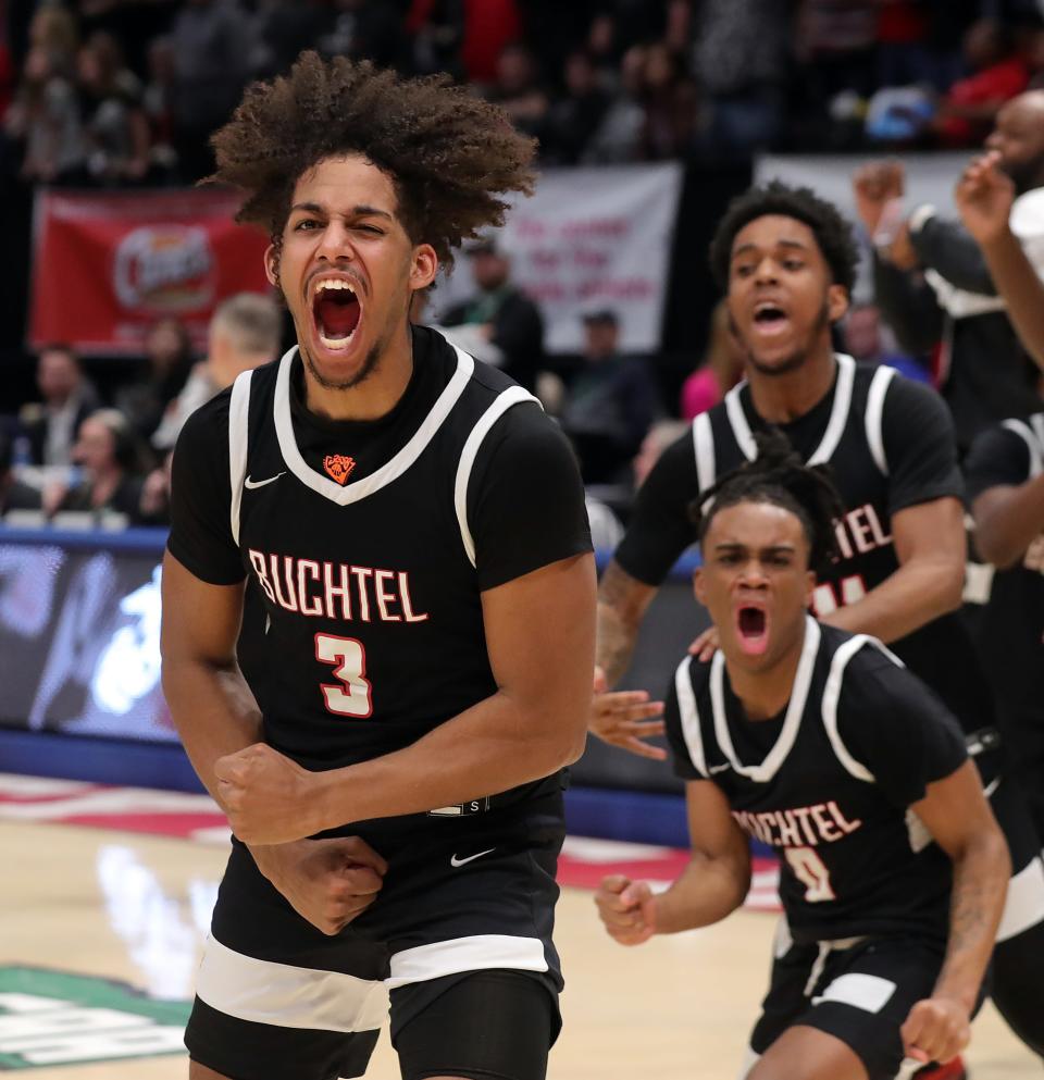 Buchtel guard Amire Robinson, left, gets fired up along with Diaire Pride Jr. and Marcel Boyce Jr. after the Griffins took down the Lutheran West Longhorns, 51-49, to win the OHSAA Division II state championship basketball game at UD Arena, Sunday, March 19, 2023, in Dayton, Ohio.