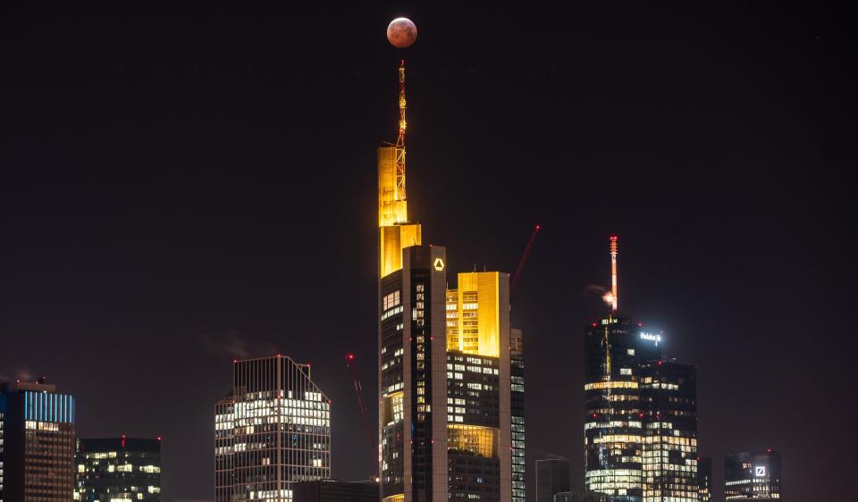 The super blood moon above the skyline of Frankfurt,&nbsp;Germany, Jan. 21.