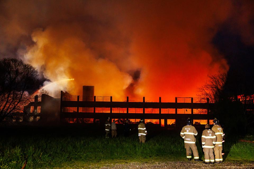 Firefighters from across the county battle a massive six-alarm inferno that ripped through the old Stewartstown Furniture Factory on Mill Street, Saturday, April 27, 2024, in Stewartstown. The fire was the largest fire in Stewartstown's history, the fire chief said.