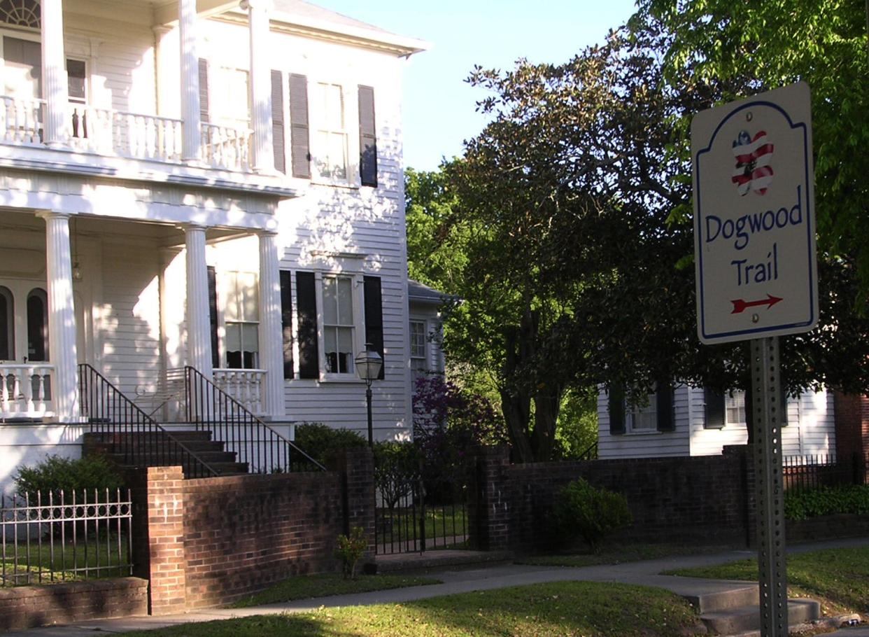 Dogwood Trail sign with the Sanford House at Heritage Square in the background. Fayetteville's historic district is one of the first areas in the city to be developed in the 1700s. In the 1800s, the Heritage Square neighborhood was home to a notorious crime that made headlines across the state.