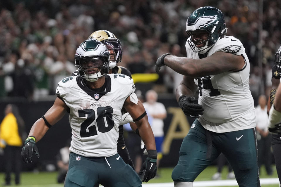 Philadelphia Eagles running back Saquon Barkley (26) celebrates after scoring a two-point conversion against the New Orleans Saints in the second half of an NFL football game in New Orleans, Sunday, Sept. 22, 2024. (AP Photo/Gerald Herbert)