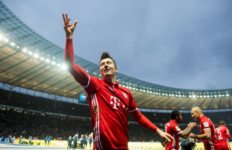 Bayern Munich's Robert Lewandowski celebrates after scoring a last minute equaliser against Hertha Berlin on February 18, 2017