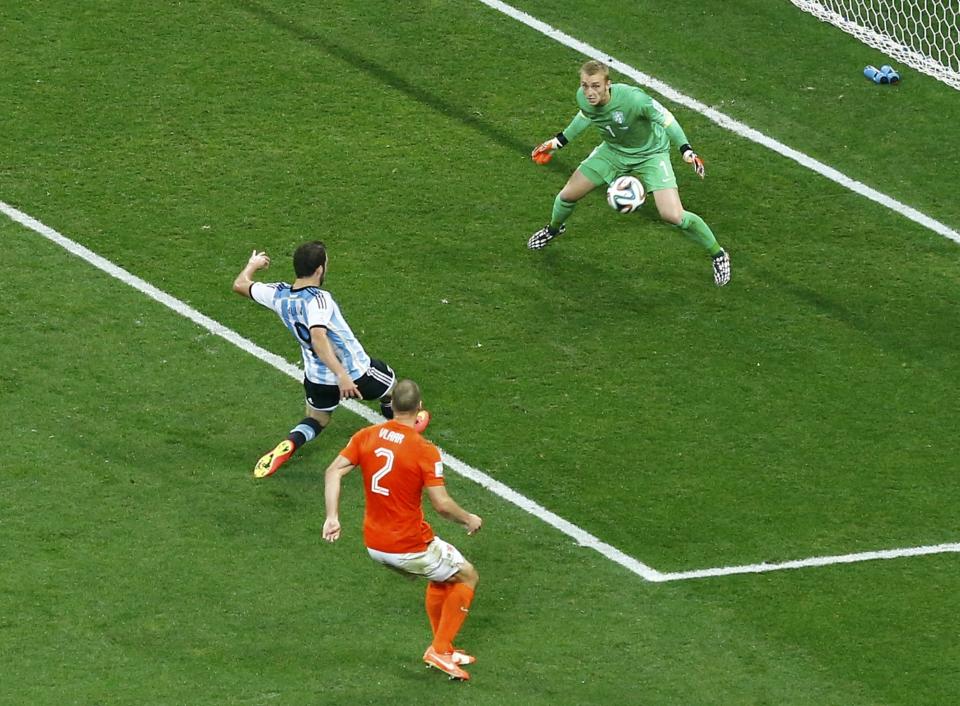 Argentina's Gonzalo Higuain misses a chance to score during their 2014 World Cup semi-finals against the Netherlands at the Corinthians arena in Sao Paulo