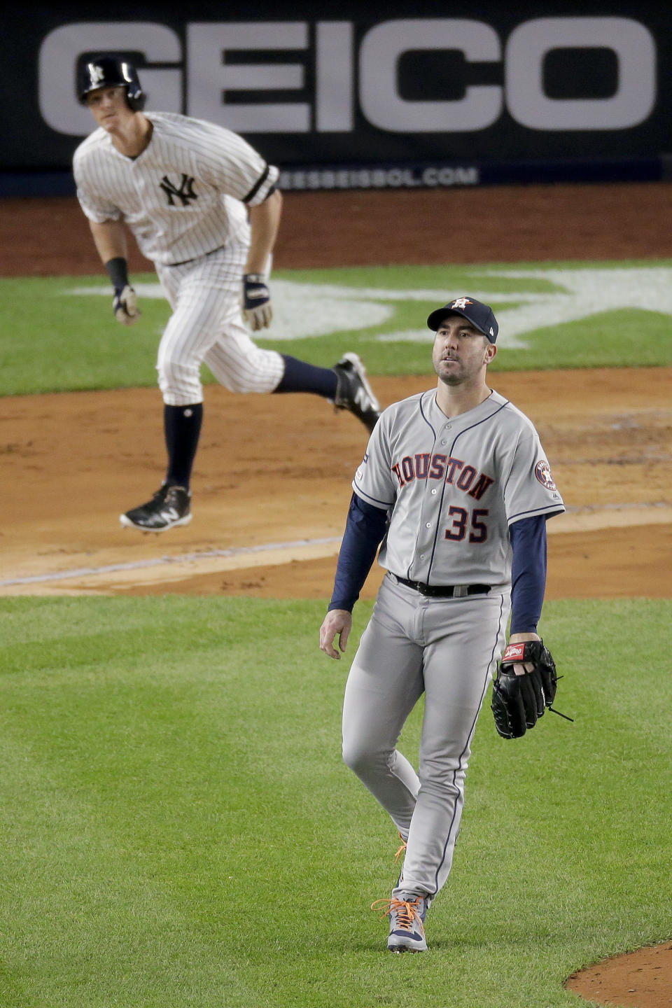 Houston Astros starting pitcher Justin Verlander (35) watches as a solo home run by New York Yankees' DJ LeMahieu sails over the right field wall during the first inning of Game 5 of baseball's American League Championship Series, Friday, Oct. 18, 2019, in New York. (AP Photo/Seth Wenig)